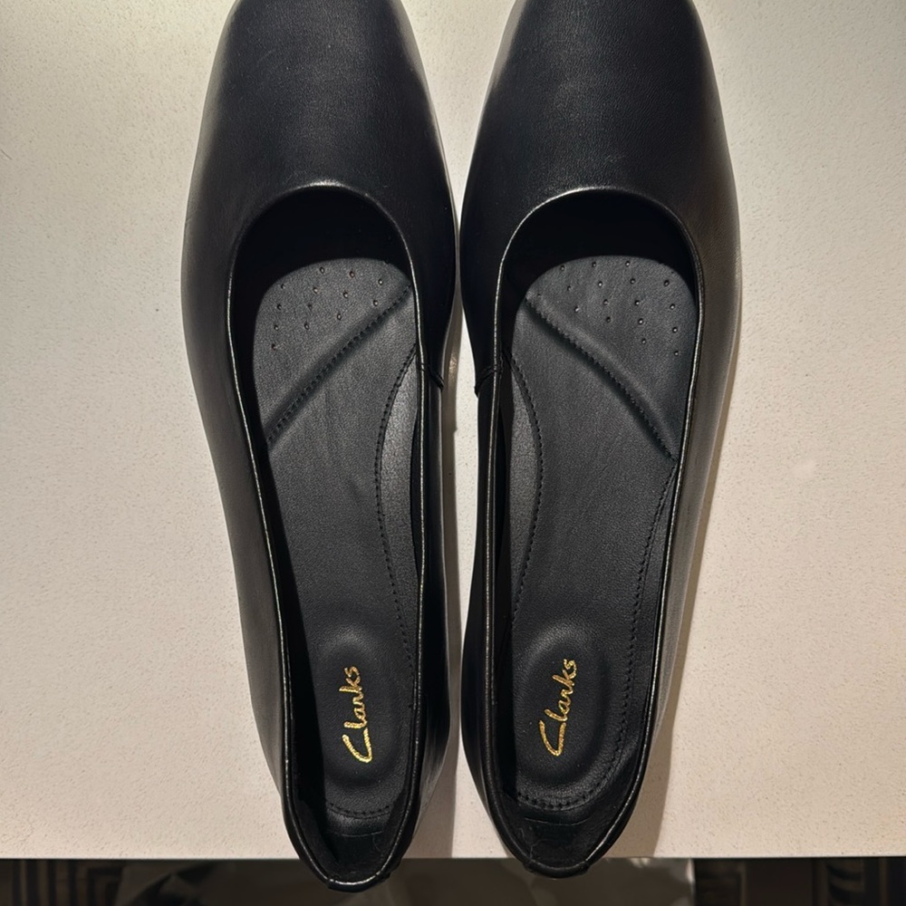 Clark’s Black leather ballet flats.